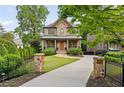 Beautiful brick home with a long driveway, manicured lawn, and lush landscaping at 2017 Harts Mill Ne Rd, Chamblee, GA 30341