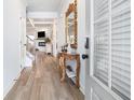 Bright entryway featuring luxury floors, stylish mirror, and neutral paint colors at 35 Henson Farm Dr, Loganville, GA 30052