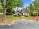Attractive home with a well-manicured lawn, beautiful landscaping, and a convenient parking area at 3765 Windsor Cir, Clarkston, GA 30021