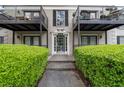 View of building entrance, showcasing well-maintained landscaping and access at 3440 Essex Ave # 103, Atlanta, GA 30339
