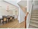 Elegant entryway with staircase, hardwood floors, and dining room access at 172 Mill Creek Dr, Canton, GA 30115