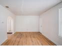 Bright living room with original hardwood floors, awaiting your personal touch at 2447 Crestview Ave, Decatur, GA 30032