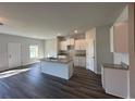 Modern kitchen with white cabinets, granite countertops, and stainless steel sink at 8658 Webb Rd, Riverdale, GA 30274