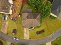 Aerial view of a well-maintained home with a lush green lawn at 120 Clifford Ct, Canton, GA 30115