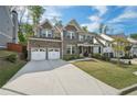 Beautiful two-story home with brick facade, two-car garage, and well-maintained landscaping at 429 Nickajack Retreat Se Ln, Smyrna, GA 30082