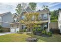 Well-kept two-story home with a brick facade, lovely landscaping, and a cozy front porch at 429 Nickajack Retreat Se Ln, Smyrna, GA 30082