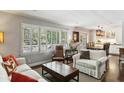 Open-concept living space combining living, dining, and kitchen areas with lots of natural light at 3005 Howell Mill Rd, Atlanta, GA 30327