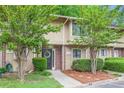 Inviting townhouse featuring a wreath on the door and lush green landscaping at 2004 Stratford Se Pl, Marietta, GA 30067