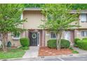 A row of townhouses with greenery and sidewalks, creating a cozy neighborhood feel at 2004 Stratford Se Pl, Marietta, GA 30067