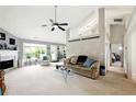Spacious living room offers a cozy seating area, a fireplace, and a seamless transition to the outdoors at 2487 Battery Pointe, Lawrenceville, GA 30043