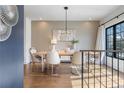 Elegant dining room with hardwood floors, designer lighting, and a large window at 726 Edgewood Ne Ave, Atlanta, GA 30307