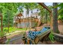 Relaxing backyard retreat with a swing, a deck, and lush greenery at 1703 Brandywine Ct, Atlanta, GA 30338
