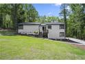Charming exterior with a well-manicured lawn, stylish siding, and welcoming front entry at 1819 Laurel Ridge Sw Dr, Conyers, GA 30094