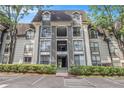 A well-maintained condo exterior showcases lush green hedges and reserved parking at 2657 Lenox Ne Rd # C38, Atlanta, GA 30324