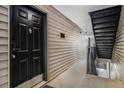 Condo front door and hallway leading to stairs at 2657 Lenox Ne Rd # C38, Atlanta, GA 30324
