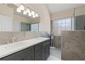 Elegant bathroom with dual sinks, modern fixtures, and a glass-enclosed shower, with natural light at 3850 Pilgrim Mill Rd, Cumming, GA 30041