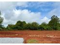 A new home construction site shows the initial foundation work on a sunny day at 500 Charleston Pl, Villa Rica, GA 30180