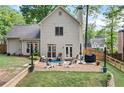 Expansive backyard boasting a stone patio, perfect for outdoor dining and entertaining at 3376 Hickory Ln, Powder Springs, GA 30127