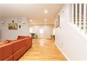 Spacious living area with hardwood floors, connecting to the kitchen and dining area at 398 Nw Westchester Blvd, Atlanta, GA 30314