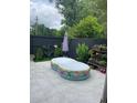 Relaxing backyard with a colorful inflatable pool, and a charming patio area at 1805 Ashborough Se Cir # D, Marietta, GA 30067