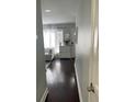 Welcoming hallway with beautiful hardwood floors and natural light from the window at 1805 Ashborough Se Cir # D, Marietta, GA 30067