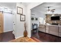 Inviting living room with stone fireplace, ceiling fans, and dark wood flooring at 1965 Stilesboro Nw Dr, Kennesaw, GA 30152
