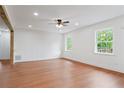 Bright living room featuring hardwood floors, natural light and neutral walls at 472 Rigby Ne St, Marietta, GA 30060