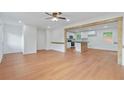 Open-concept living room featuring hardwood floors and leading into a stylish kitchen at 472 Rigby Ne St, Marietta, GA 30060