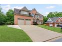 Lovely brick home with a spacious driveway, two-car garage, and a well-kept lawn at 3341 Cranmore Chase, Marietta, GA 30066