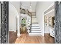 Spacious foyer with hardwood floors, a grand staircase, and abundant natural light at 3851 Glenhurst Se Dr, Smyrna, GA 30080