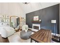 Bright office with a fireplace, vaulted ceilings, and views of the backyard at 3851 Glenhurst Se Dr, Smyrna, GA 30080