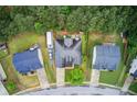 Aerial view of a home with a large roof, mature trees, and well-maintained yard at 51 Norton Ave, Acworth, GA 30101