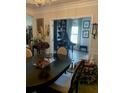 Elegant dining room featuring hardwood floors and stylish decor and adjoining Living Room with piano at 51 Norton Ave, Acworth, GA 30101