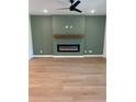 Spacious living room features a modern electric fireplace and neutral color palette at 1932 Appian Aly, Kennesaw, GA 30144