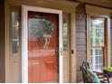 Close-up of the front door with decorative wreath and sidelight windows at 238 Ivy Glen Cir, Avondale Estates, GA 30002