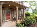 Inviting front porch with decorative columns and well-maintained landscaping at 238 Ivy Glen Cir, Avondale Estates, GA 30002