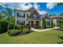 Charming home featuring a beautifully landscaped yard, manicured shrubs, and a welcoming walkway at 3755 Valleyway Rd, Cumming, GA 30040