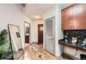 Hallway with wood flooring leads to private areas, features a convenient built-in desk and storage at 400 W Peachtree Nw St # 2614, Atlanta, GA 30308