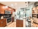Well-equipped kitchen boasts stainless steel appliances, granite countertops, and a breakfast bar at 400 W Peachtree Nw St # 2614, Atlanta, GA 30308