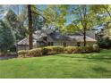 Well-maintained home with manicured landscaping and a spacious front yard at 2100 Stone Hollow Ct, Marietta, GA 30062