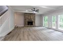 Inviting living room with stone fireplace and light-filled french doors at 375 Buckingham Dr, Marietta, GA 30066