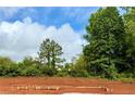 New home foundation on a sunny day with trees and sky background at 502 Charleston Pl, Villa Rica, GA 30180
