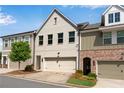 Charming townhome features a painted brick facade, attached garage, and well-maintained landscaping at 355 Niles Ct # 2, Marietta, GA 30060