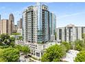 Stunning high-rise apartment building featuring modern architecture and a luxurious pool amenity at 222 12Th Ne St # 1508, Atlanta, GA 30309