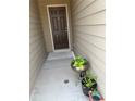 Cozy front porch with potted plants at 243 Beau St, Lilburn, GA 30047