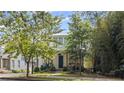 Charming home with a covered front porch surrounded by lush greenery at 676 Juneberry Se Ln, Atlanta, GA 30316