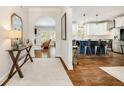 Hallway with hardwood floors leading to an open-concept kitchen and living room with neutral color palette at 1446 Wilford Ne Dr, Atlanta, GA 30319