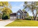 Charming two-story home features a two-car garage and a covered front porch at 3730 Morning Crest Way, Cumming, GA 30041