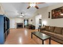 Spacious living room features a vaulted ceiling, fireplace, and hardwood floors at 10 Mcgiboney Pl, Covington, GA 30016