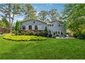 Lawn, landscaping and patio area create a charming backyard at 3772 Evans Rd, Atlanta, GA 30340